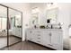 Bright bathroom with double vanity, marble countertops, and a large mirror at 16023 S 30Th Pl, Phoenix, AZ 85048
