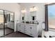 Modern bathroom featuring double sinks, updated fixtures, and a soaking tub at 16023 S 30Th Pl, Phoenix, AZ 85048