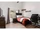 Bedroom with a ceiling fan, neutral walls, and a large window for ample light at 16023 S 30Th Pl, Phoenix, AZ 85048