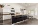Spacious kitchen featuring white cabinetry, a breakfast bar, and a cozy breakfast nook at 16023 S 30Th Pl, Phoenix, AZ 85048