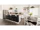 Well-lit kitchen with white cabinets, granite counters, and an open design for easy entertaining at 16023 S 30Th Pl, Phoenix, AZ 85048