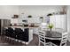 Spacious kitchen with a breakfast bar, granite countertops, modern appliances, and a breakfast nook at 16023 S 30Th Pl, Phoenix, AZ 85048