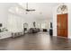 Well-lit living room with shuttered windows and vaulted ceilings at 16023 S 30Th Pl, Phoenix, AZ 85048