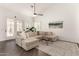 Bright living room with neutral tones, wood floors, and a comfortable sectional sofa at 16023 S 30Th Pl, Phoenix, AZ 85048
