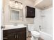 This bathroom features a shower-tub combo, a toilet, and a single sink vanity with a framed mirror at 17616 N 20Th Dr, Phoenix, AZ 85023
