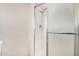 Bathroom featuring a glass-enclosed shower with white tiled walls and modern fixtures at 17616 N 20Th Dr, Phoenix, AZ 85023