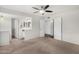 Neutral bedroom with plush carpet, a modern ceiling fan and ensuite bathroom with vanity at 17616 N 20Th Dr, Phoenix, AZ 85023