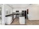 Well-lit kitchen featuring white cabinetry, stainless steel appliances, and a functional kitchen island at 17616 N 20Th Dr, Phoenix, AZ 85023