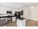 Bright and well-equipped kitchen features modern stainless appliances, white cabinets and a center island at 17616 N 20Th Dr, Phoenix, AZ 85023