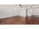 Spacious living room with gleaming wood floors and neutral wall paint at 17616 N 20Th Dr, Phoenix, AZ 85023
