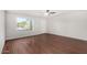 Bright living room boasts beautiful wood flooring and a large window at 17616 N 20Th Dr, Phoenix, AZ 85023