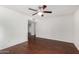 Spacious living room with gleaming wood floors and neutral wall paint at 17616 N 20Th Dr, Phoenix, AZ 85023