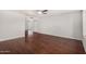 Bright living room boasts beautiful wood flooring and a ceiling fan at 17616 N 20Th Dr, Phoenix, AZ 85023