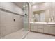 Beautiful bathroom features a spacious walk-in shower, double sinks, and modern tile at 1895 N 141St Ave, Goodyear, AZ 85395