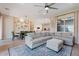 Open-concept living space with large sectional sofa, dining area, and a modern kitchen at 1895 N 141St Ave, Goodyear, AZ 85395