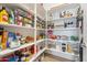 Walk-in pantry with shelving, ample storage space for food, containers, and supplies at 1895 N 141St Ave, Goodyear, AZ 85395