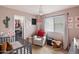 Bedroom featuring a crib, rocking chair, and fun decor, creating a cozy and inviting space for a baby at 20440 N 39Th Dr, Glendale, AZ 85308