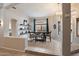 Bright dining room featuring decorative shelves, backyard views, and neutral tones at 20440 N 39Th Dr, Glendale, AZ 85308