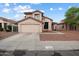 Inviting two-story home featuring a desert landscape, attached two-car garage, and neutral toned exterior paint at 20440 N 39Th Dr, Glendale, AZ 85308