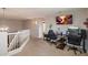 Open upstairs landing featuring neutral walls, carpeted floors and a built-in desk area perfect for a home office or study space at 20440 N 39Th Dr, Glendale, AZ 85308