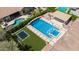 Aerial view displaying a luxurious pool with water features, a spa, and outdoor seating area at 20585 W Garden St, Buckeye, AZ 85396