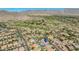 Stunning aerial view of a Primary-planned community nestled amidst the desert landscape and golf course at 20585 W Garden St, Buckeye, AZ 85396