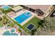 Aerial view showcasing a swimming pool, jacuzzi, trampoline, and landscaped backyard at 20585 W Garden St, Buckeye, AZ 85396