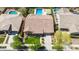 This home features a tile roof, mature landscaping, and a well-manicured lawn for curb appeal at 20585 W Garden St, Buckeye, AZ 85396
