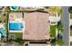 Aerial view of an outdoor space with a sparkling pool, jacuzzi, trampoline, and covered patio at 20585 W Garden St, Buckeye, AZ 85396