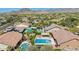 Aerial neighborhood view showcasing numerous homes with pools, and beautiful desert scenery at 20585 W Garden St, Buckeye, AZ 85396