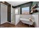 Bathroom showcasing a glass enclosed shower and claw foot bathtub at 20585 W Garden St, Buckeye, AZ 85396
