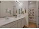 Bright bathroom with double vanity sinks and shower curtain at 20585 W Garden St, Buckeye, AZ 85396