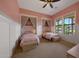 Charming bedroom with two beds, a window, and decorative accents at 20585 W Garden St, Buckeye, AZ 85396