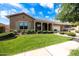 Charming single-story home with a well-manicured lawn and covered porch at 20585 W Garden St, Buckeye, AZ 85396