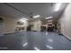 Spacious garage with epoxy flooring, ample storage space, and room for multiple vehicles at 20585 W Garden St, Buckeye, AZ 85396
