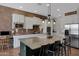 Modern kitchen with brick backsplash, granite counters, and stainless steel appliances at 20585 W Garden St, Buckeye, AZ 85396