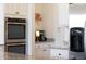 Modern kitchen features stainless steel appliances, custom cabinetry, and ample countertop space for cooking and entertaining at 20585 W Garden St, Buckeye, AZ 85396