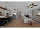 Bright open living space featuring a kitchen, a piano, and a comfy living room at 20585 W Garden St, Buckeye, AZ 85396