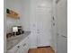 Well-organized pantry featuring ample counter space, shelving, and convenient access to both the kitchen and pantry areas at 20585 W Garden St, Buckeye, AZ 85396