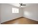 Neutral bedroom featuring a ceiling fan and a window at 2127 W San Miguel Ave, Phoenix, AZ 85015