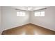 Bright empty bedroom featuring a ceiling fan and large windows at 2127 W San Miguel Ave, Phoenix, AZ 85015