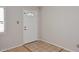 Bright entryway featuring a white door with decorative glass and neutral tile flooring at 2127 W San Miguel Ave, Phoenix, AZ 85015