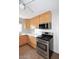 Kitchen with stainless steel oven, light wood cabinets and white stone countertops at 2127 W San Miguel Ave, Phoenix, AZ 85015