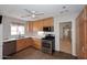 Bright kitchen featuring wooden cabinets, stainless steel appliances, and stone countertops at 2127 W San Miguel Ave, Phoenix, AZ 85015