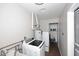 Functional laundry room with modern appliances and storage shelves at 2127 W San Miguel Ave, Phoenix, AZ 85015