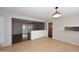 Open-concept living space featuring hardwood floors, and a stylish light fixture at 2127 W San Miguel Ave, Phoenix, AZ 85015
