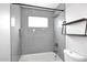 Modern tiled shower with recessed shelf and shower head at 2127 W San Miguel Ave, Phoenix, AZ 85015