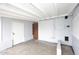 The storage room features painted brick walls and concrete flooring at 2127 W San Miguel Ave, Phoenix, AZ 85015