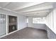 The sunroom offers tile flooring and white wood beam ceiling with access to the backyard at 2127 W San Miguel Ave, Phoenix, AZ 85015