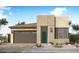 Modern single-story home featuring a stylish facade, a two-car garage, and desert landscaping at 2168 E Mill Rd, San Tan Valley, AZ 85140
